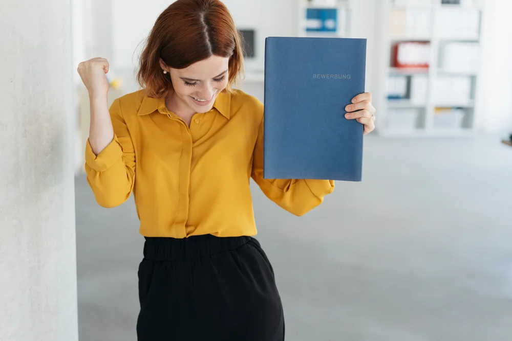 A marketing leader celebrating a successful application